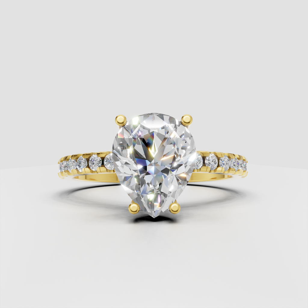 Pear diamond engagement ring with prong setting and pavé shoulders