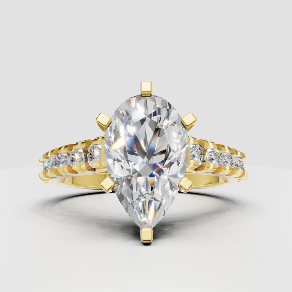 Pear cut diamond cathedral engagement ring with six-prong setting and pavé side stones in polished yellow gold.