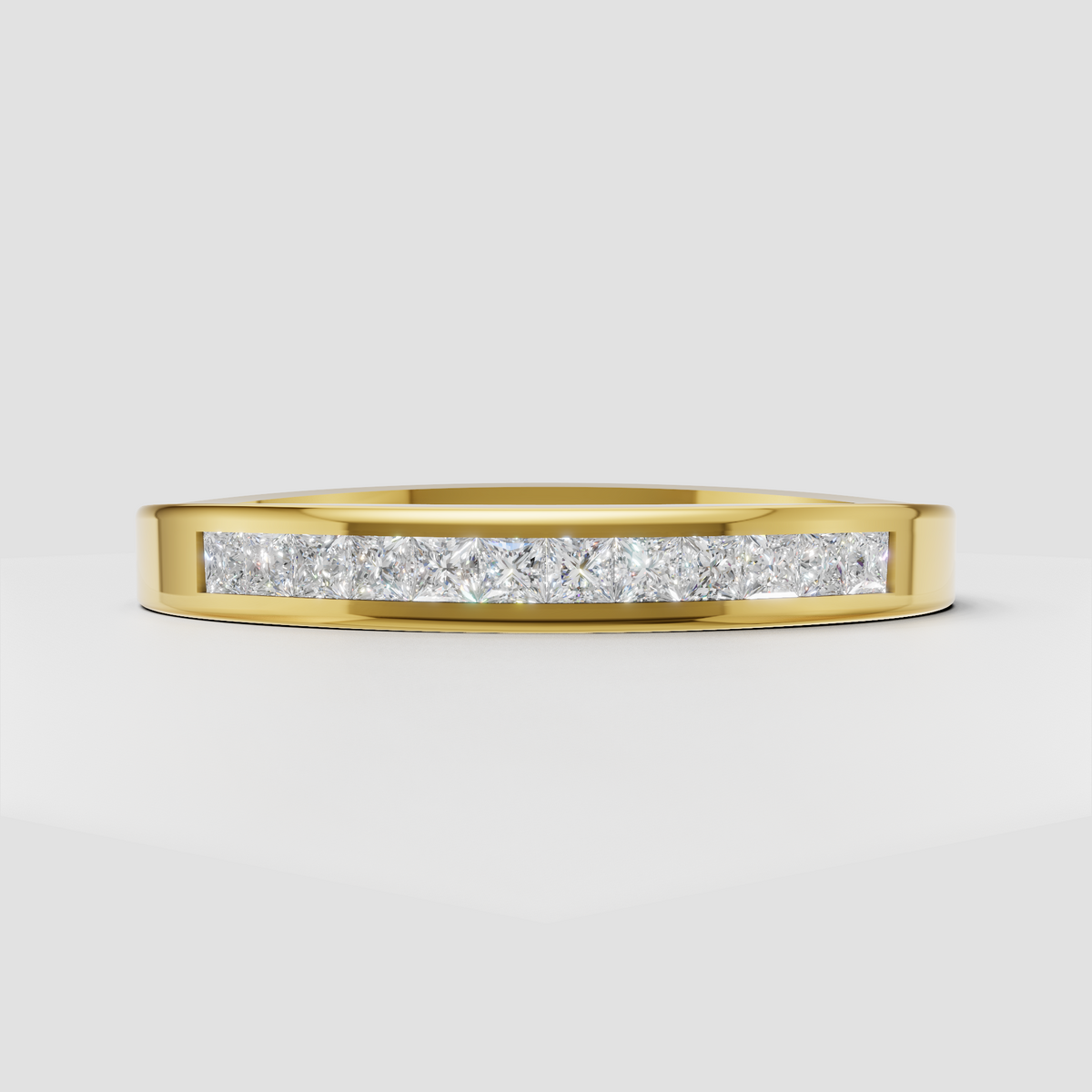 Diamond channel set wedding band in polished yellow gold