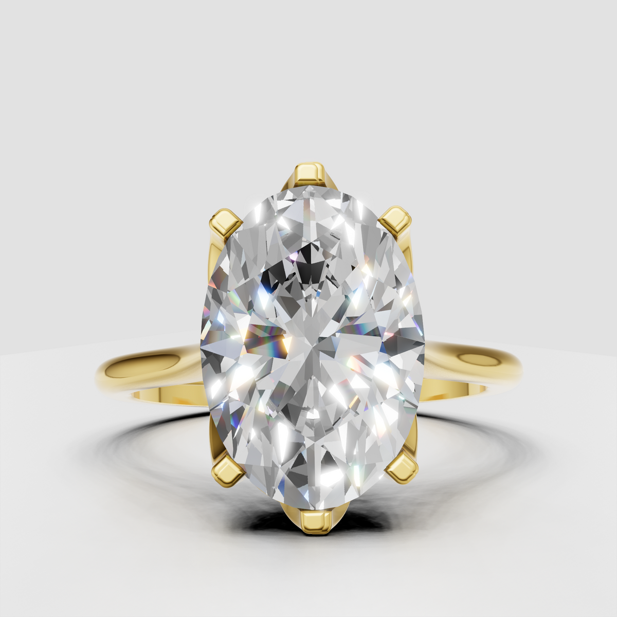 Oval diamond solitaire engagement ring in yellow gold