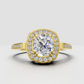 Cushion diamond halo engagement ring in yellow gold