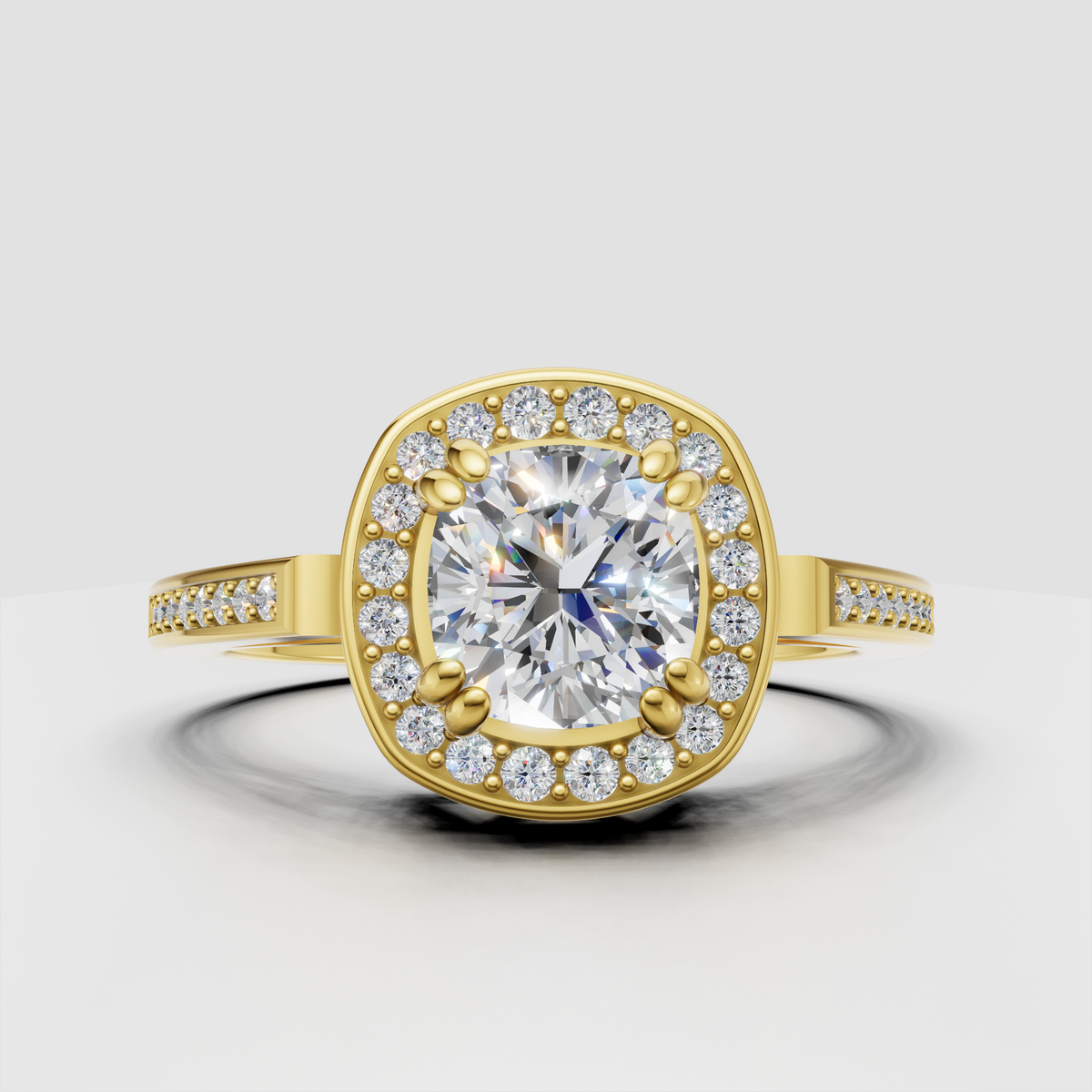 Cushion diamond halo engagement ring in yellow gold