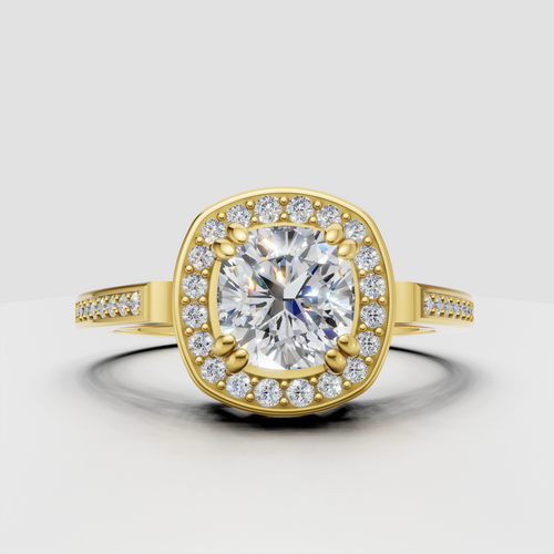 Cushion diamond halo engagement ring in yellow gold