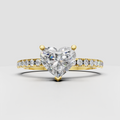 Heart shaped diamond engagement ring with pavé band