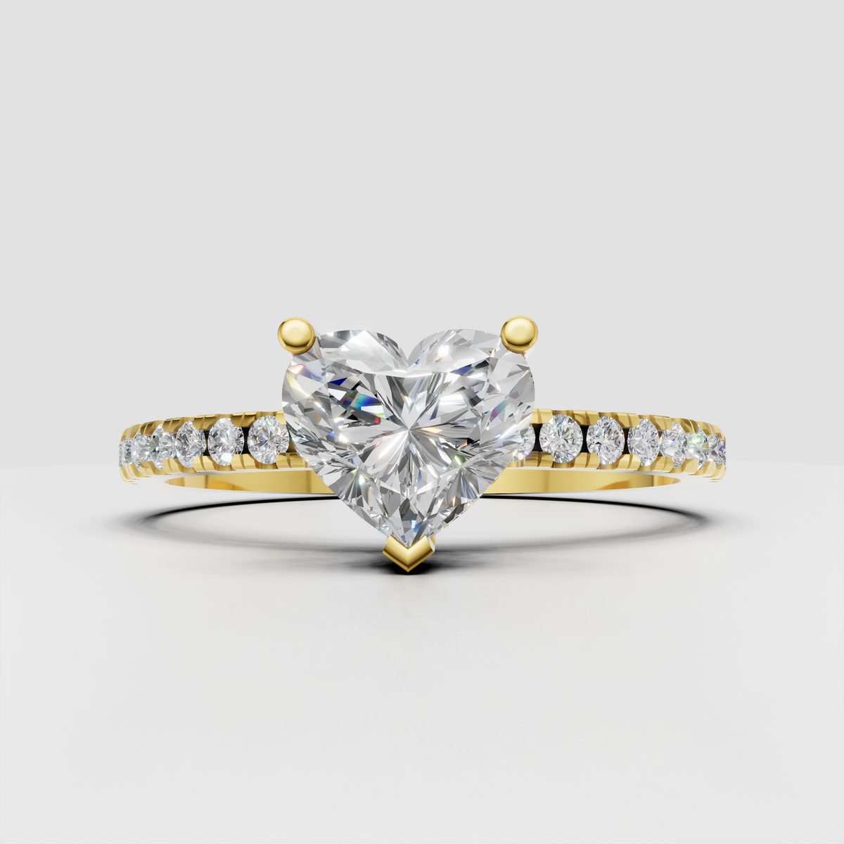 Heart shaped diamond engagement ring with pavé band