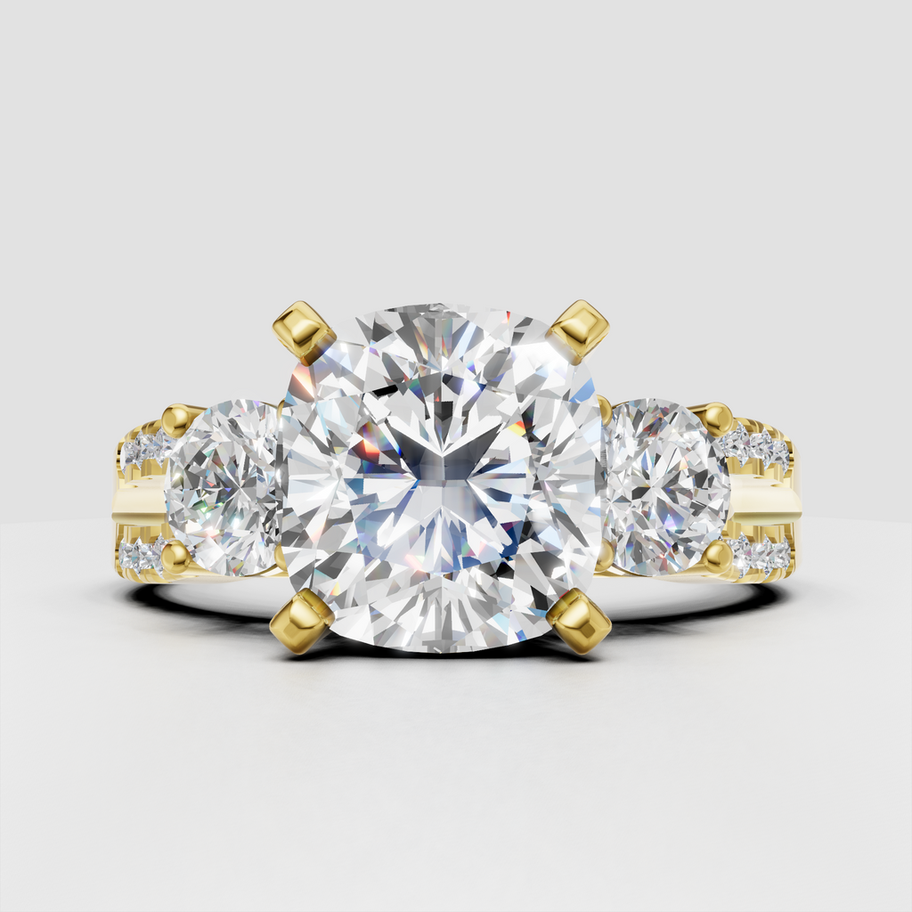 Oval diamond three stone split shank engagement ring in yellow gold