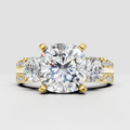 Oval diamond three stone split shank engagement ring in yellow gold