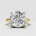 Round cut solitaire diamond ring in polished yellow gold