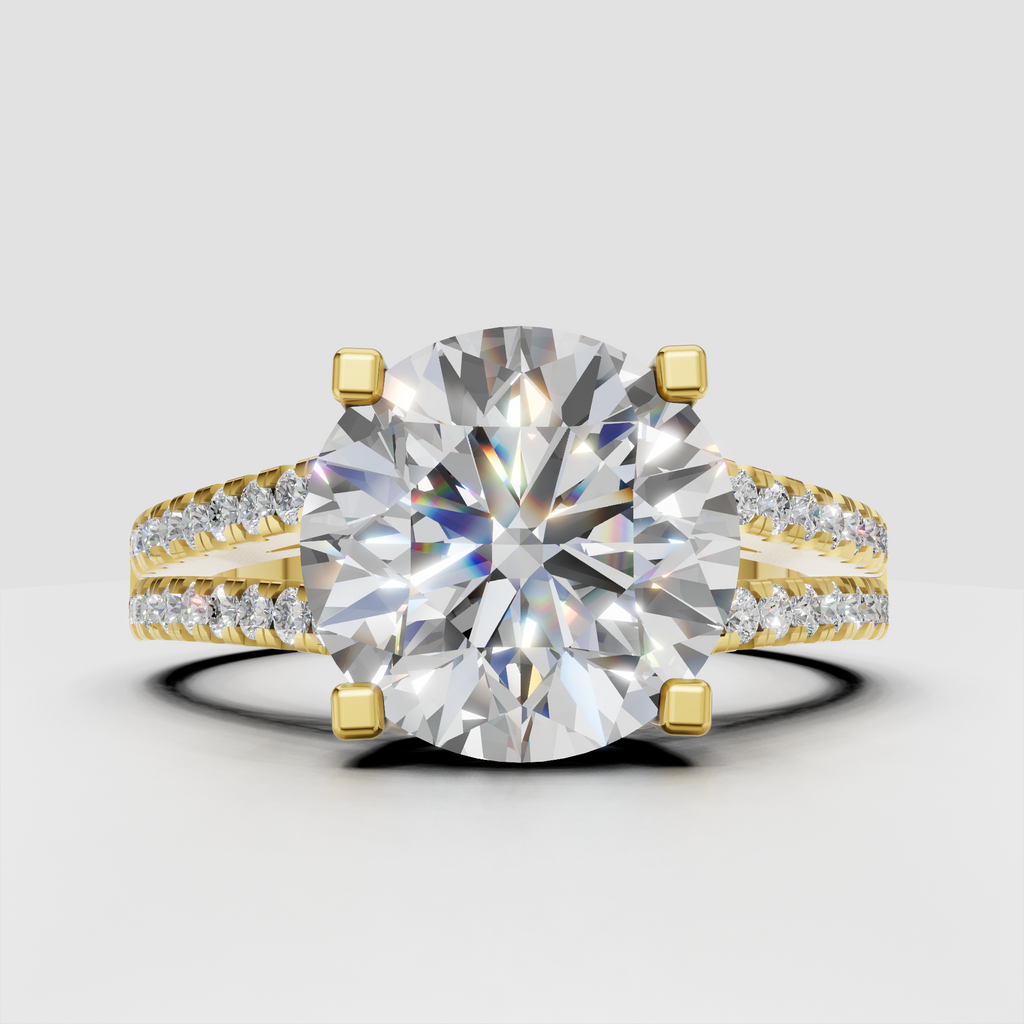 Round diamond engagement ring with split shank pavé band in polished yellow gold