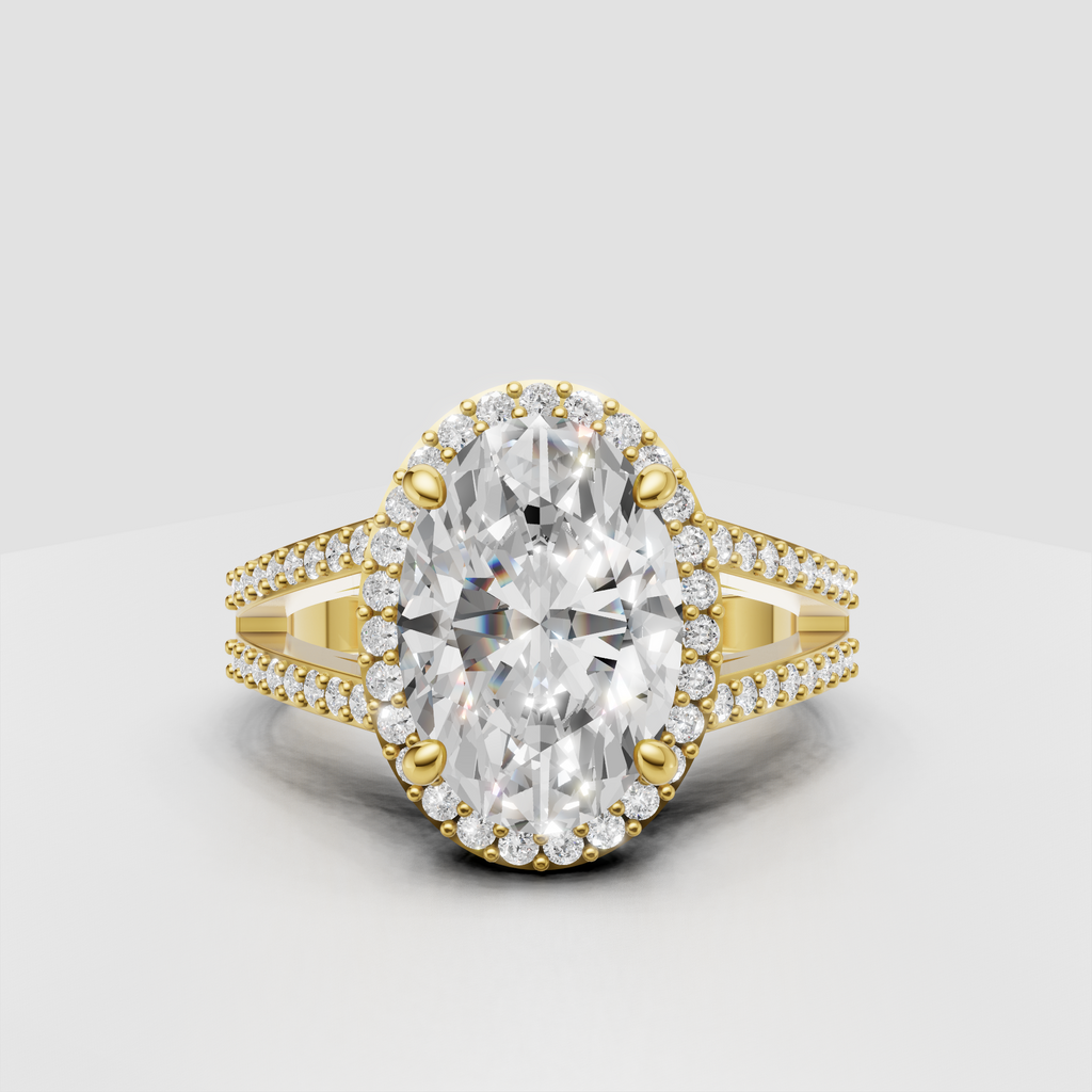 Oval diamond halo engagement ring in polished yellow gold.
