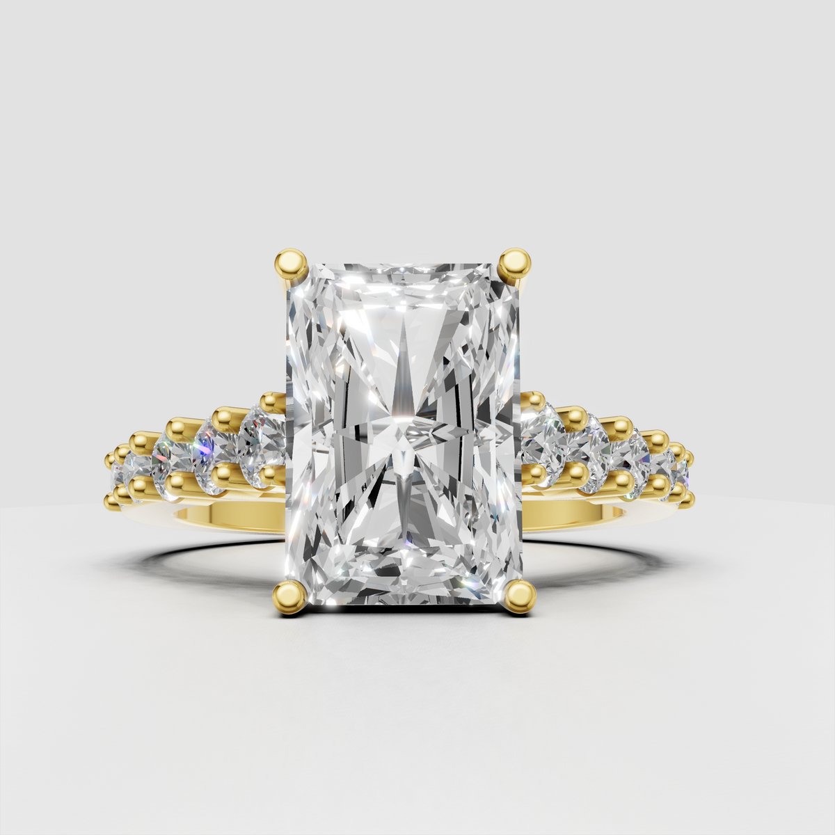 Radiant cut diamond crossover engagement ring in polished yellow gold