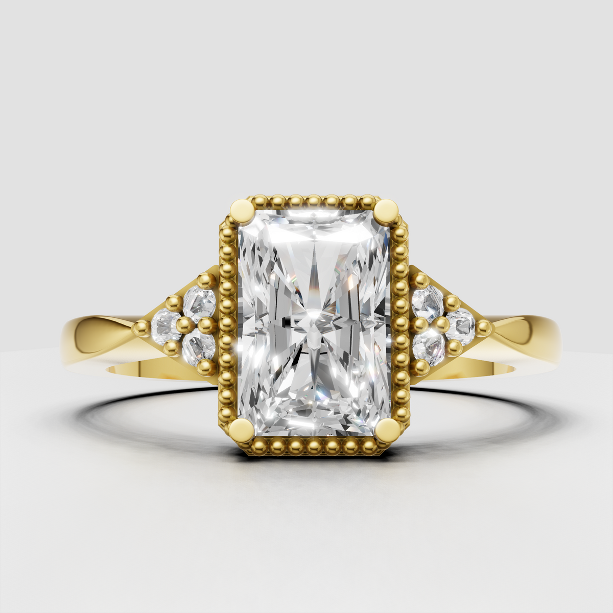 Radiant cut diamond engagement ring with beaded halo and yellow gold band