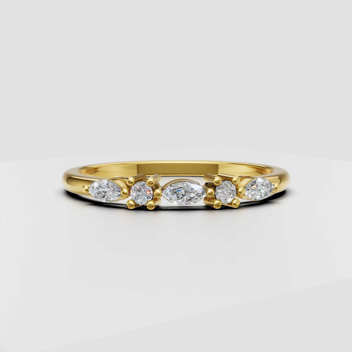 Yellow gold round and marquise diamond wedding ring with prong settings