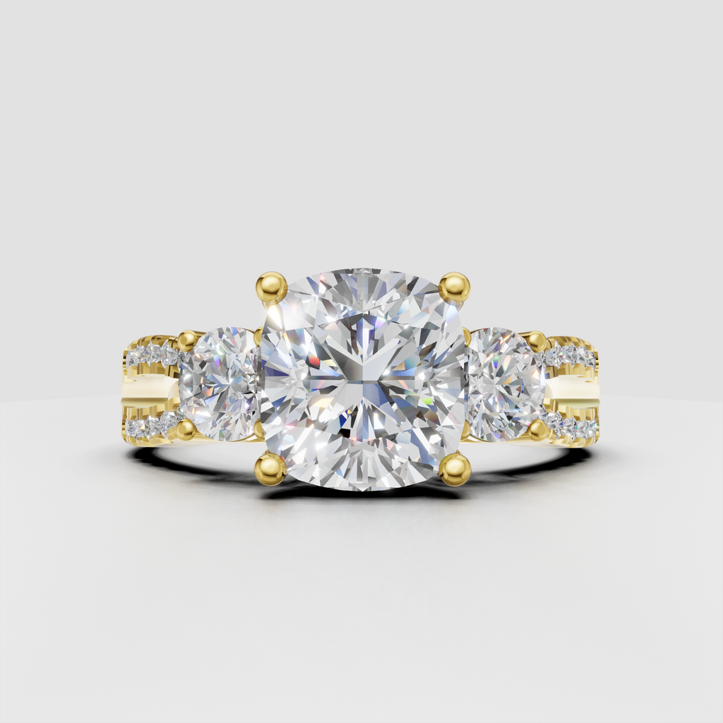 Cushion cut diamond three stone ring in yellow gold