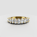 Oval diamond full eternity band ring in polished yellow gold with shared prong setting