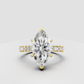 Marquise diamond four-prong yellow gold engagement ring with pavé side stones