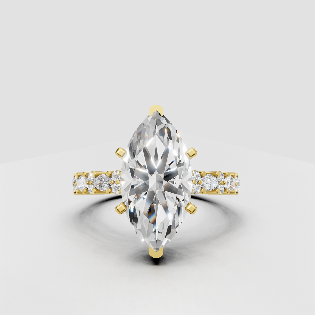 Marquise diamond four-prong yellow gold engagement ring with pavé side stones
