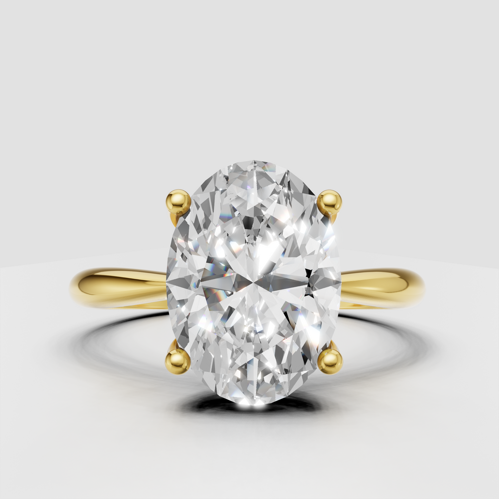Oval brilliant Diamond four-prong solitaire engagement ring in polished yellow gold