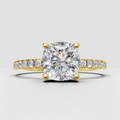 Cushion diamond cathedral pavé engagement ring in yellow gold
