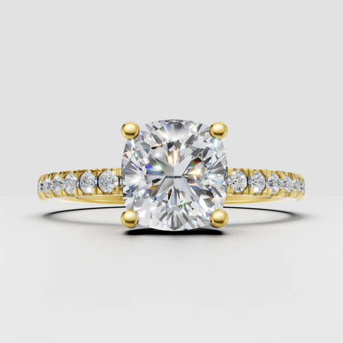 Cushion diamond cathedral pavé engagement ring in yellow gold