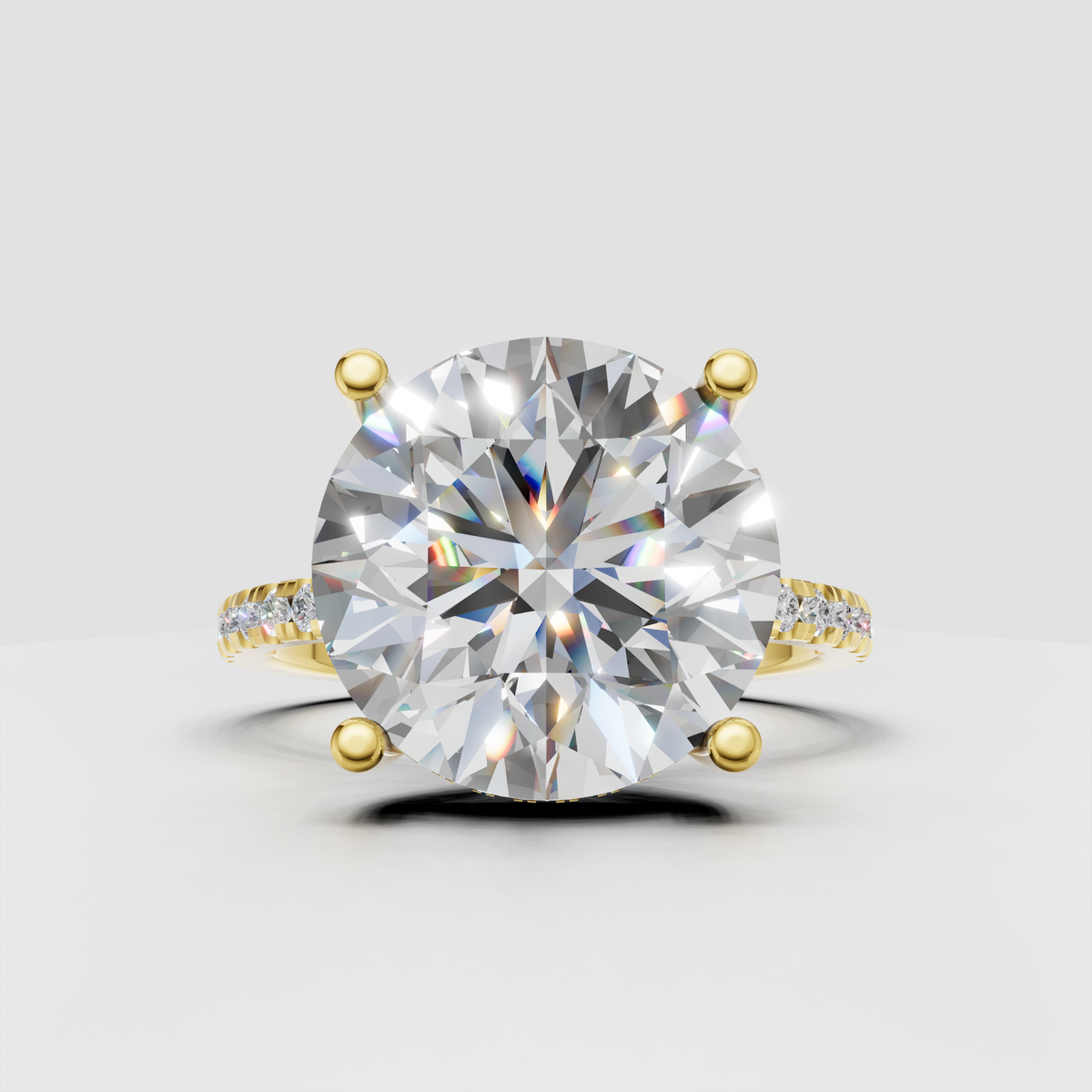 Round cut diamond hidden halo pavé engagement ring with four-prong setting in polished yellow gold.