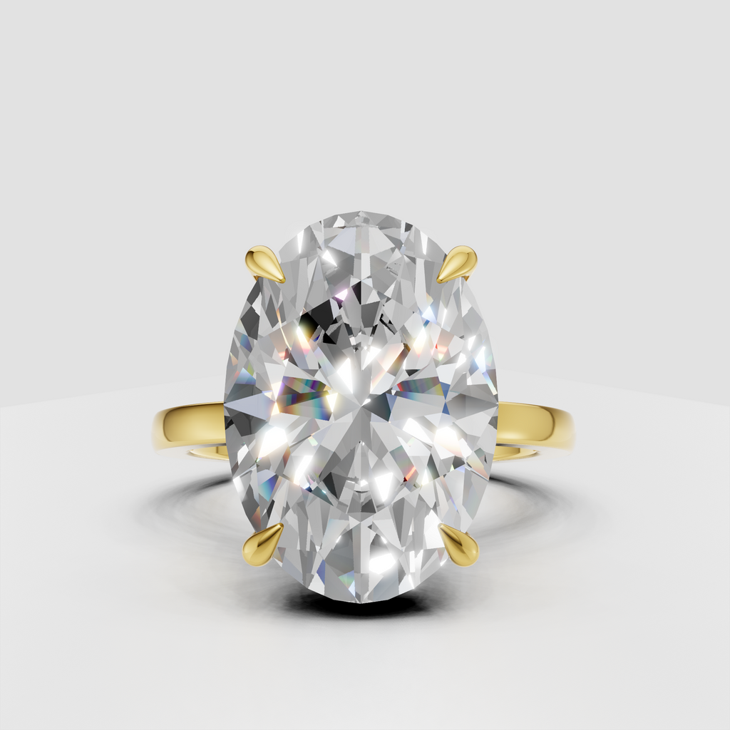 Oval cut diamond ring with hidden halo and gold prong setting