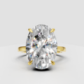 Oval cut diamond ring with hidden halo and gold prong setting