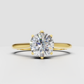 Round cut diamond engagement ring in yellow gold