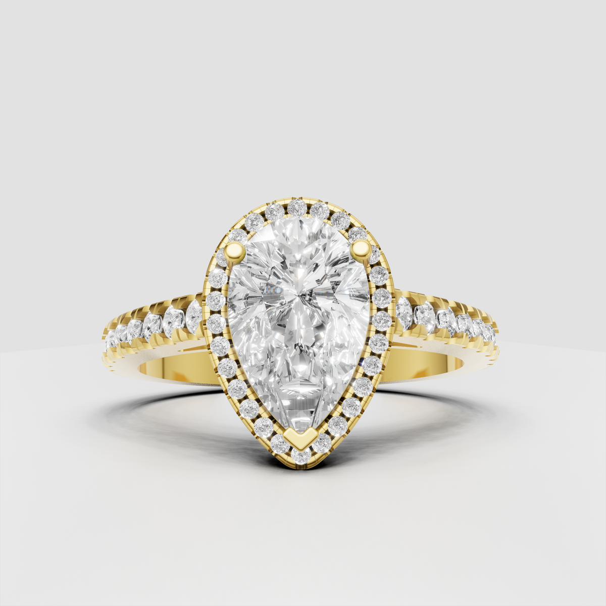 Pear cut diamond halo engagement ring with pave band in yellow gold