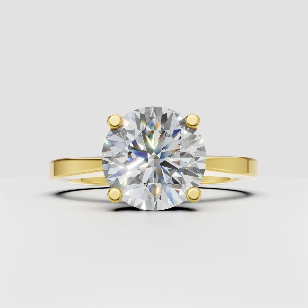 Round diamond four-prong solitaire engagement ring in polished yellow gold