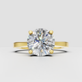 Round diamond four-prong solitaire engagement ring in polished yellow gold
