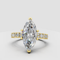 Marquise cut diamond ring with prong setting in polished gold