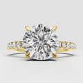 Round cut diamond engagement ring in yellow gold