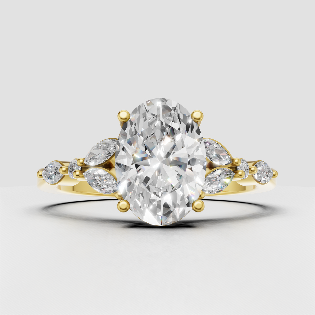 Oval cut diamond ring with marquise diamond cluster in yellow gold