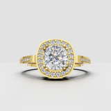 Cushion diamond halo engagement ring with pavé diamond accent band in yellow gold