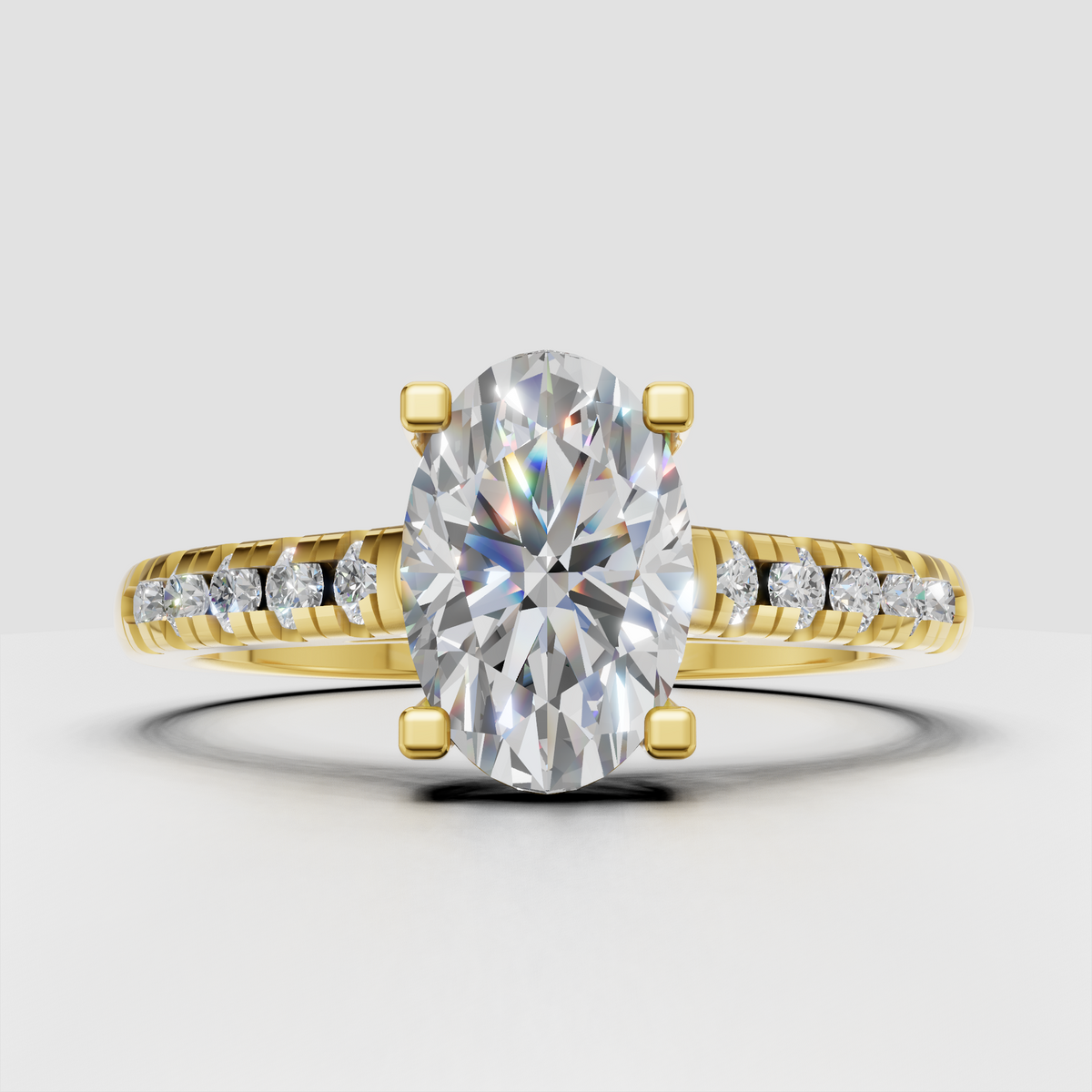 Oval diamond solitaire engagement ring with pavé band in yellow gold