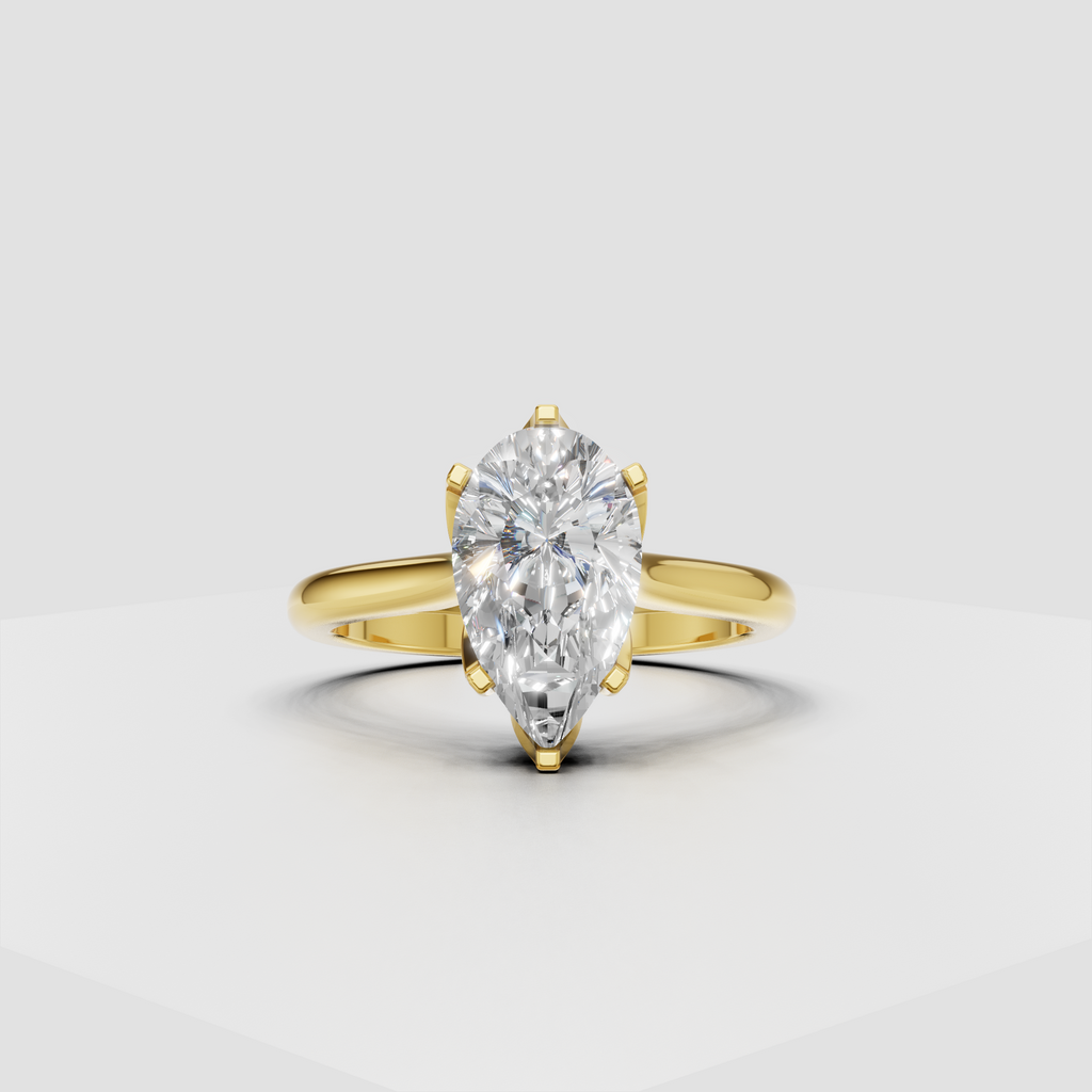 Pear-shaped diamond cathedral solitaire engagement ring in polished yellow gold