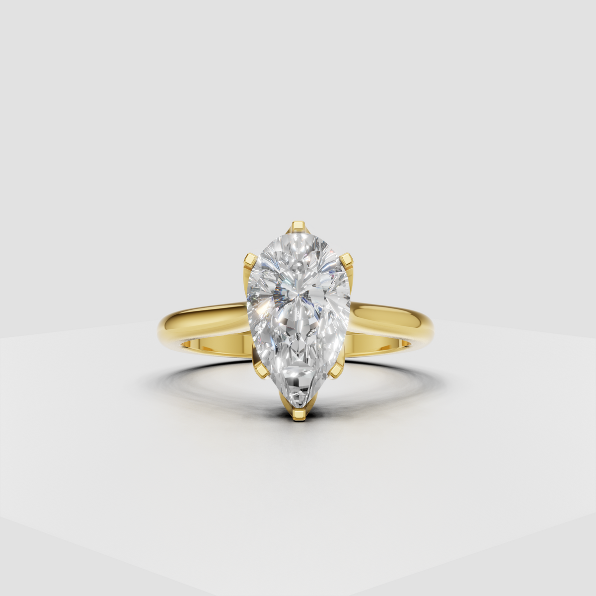 Pear-shaped diamond cathedral solitaire engagement ring in polished yellow gold