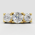Round brilliant Diamond three-stone pavé trellis engagement ring in yellow gold