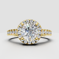 Round diamond four-prong halo pavé engagement ring in yellow gold