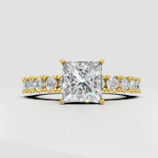 Princess cut diamond four-prong yellow gold engagement ring with pavé side stones