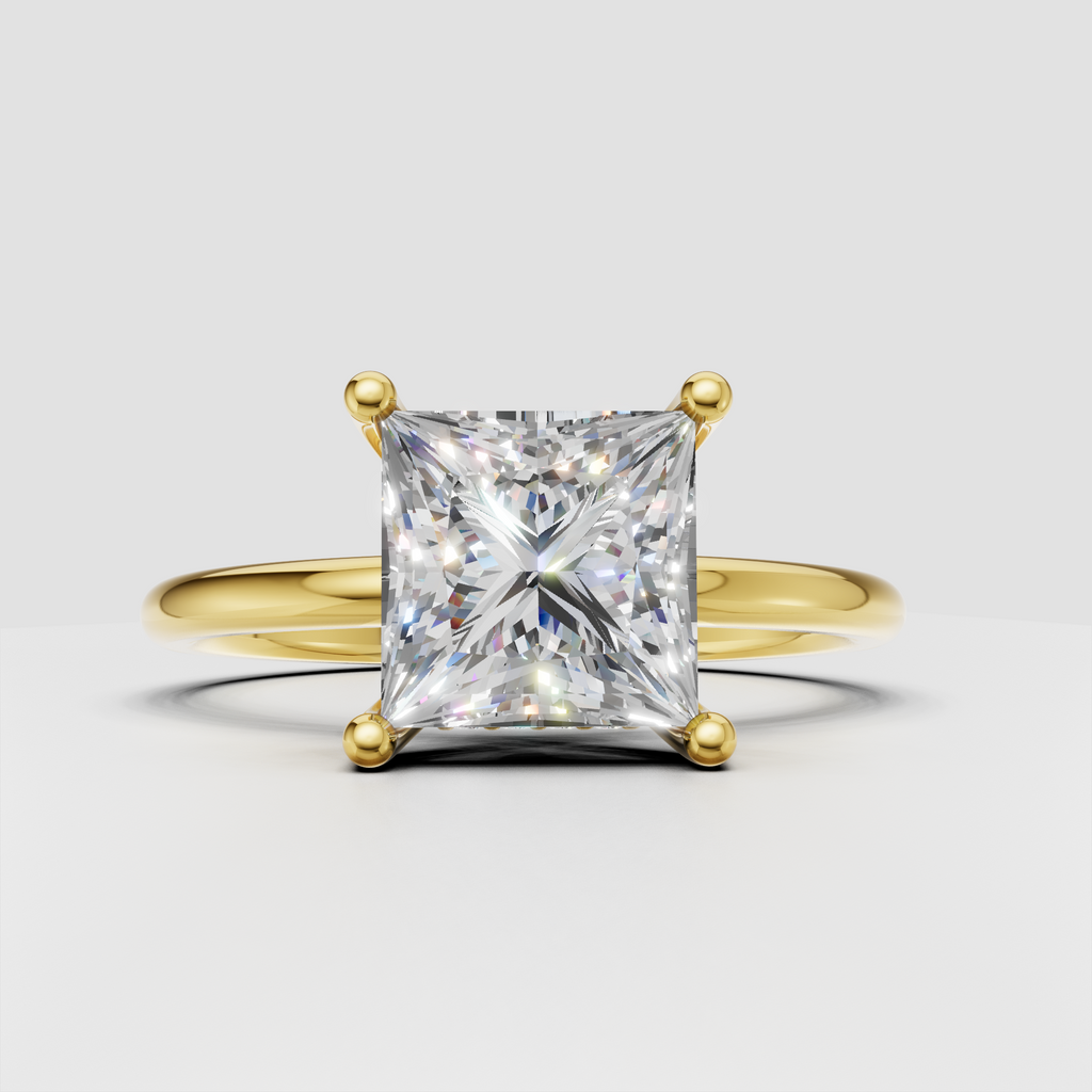 Princess cut diamond solitaire engagement ring in polished yellow gold with four-prong setting