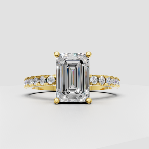 Emerald diamond four-prong pavé engagement ring in yellow gold