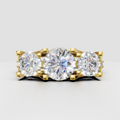 Round diamond three-stone cathedral pave engagement ring in polished silver