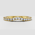 Round diamond pavé eternity wedding band in polished yellow gold
