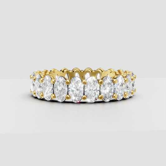 Oval cut diamond full eternity wedding band in polished yellow gold