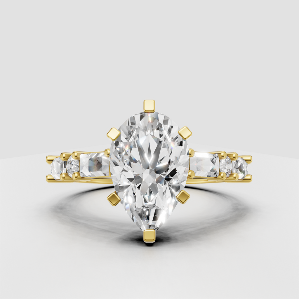 Pear cut diamond engagement ring with six-prong setting and baguette side stones