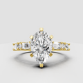 Pear cut diamond engagement ring with six-prong setting and baguette side stones
