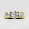 Round diamond three stone ring in polished 14K yellow gold