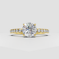 Round cut diamond four-prong pavé engagement ring in yellow gold